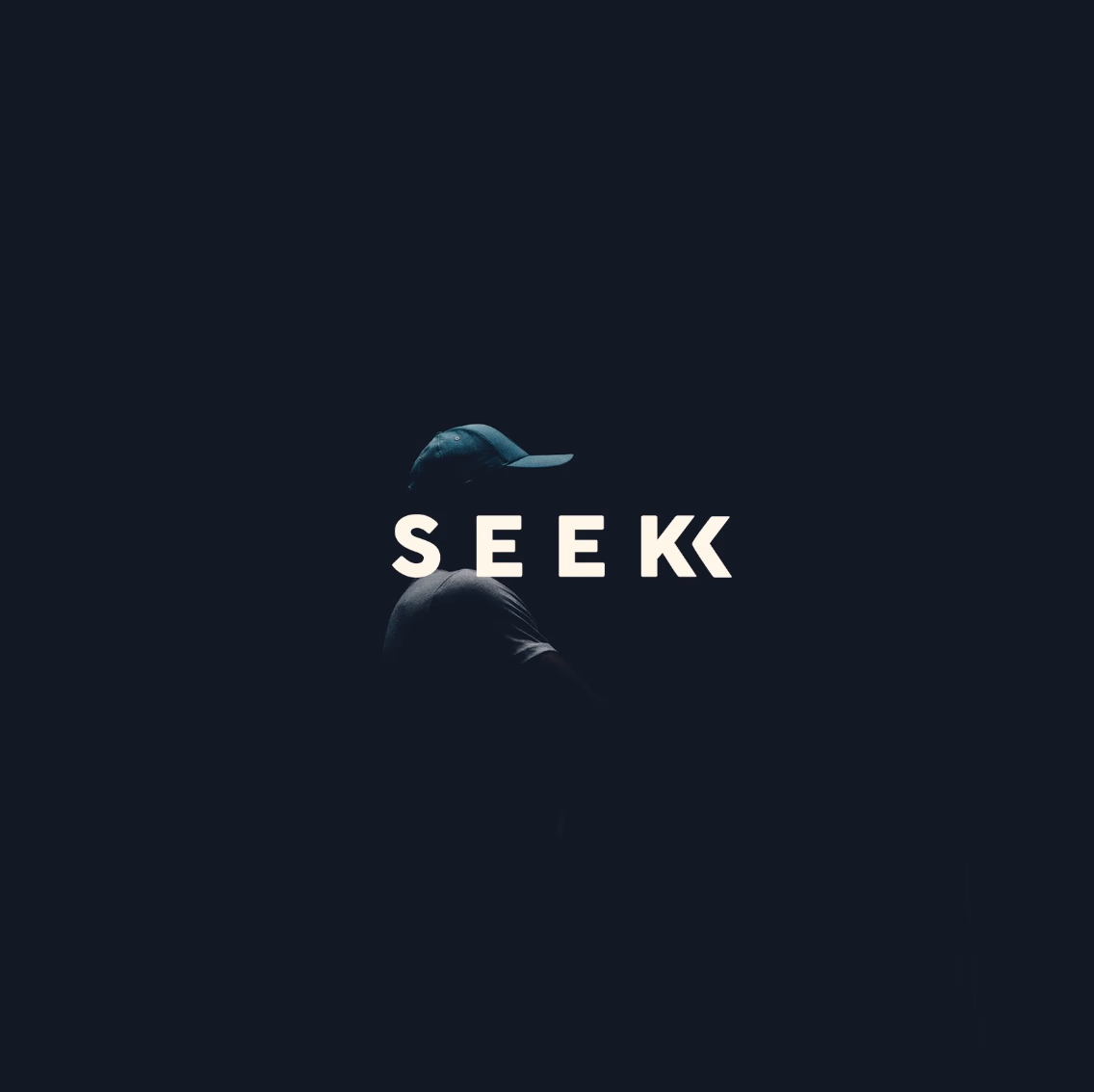 Seek Discomfort wordmark — directional arrow detail.
