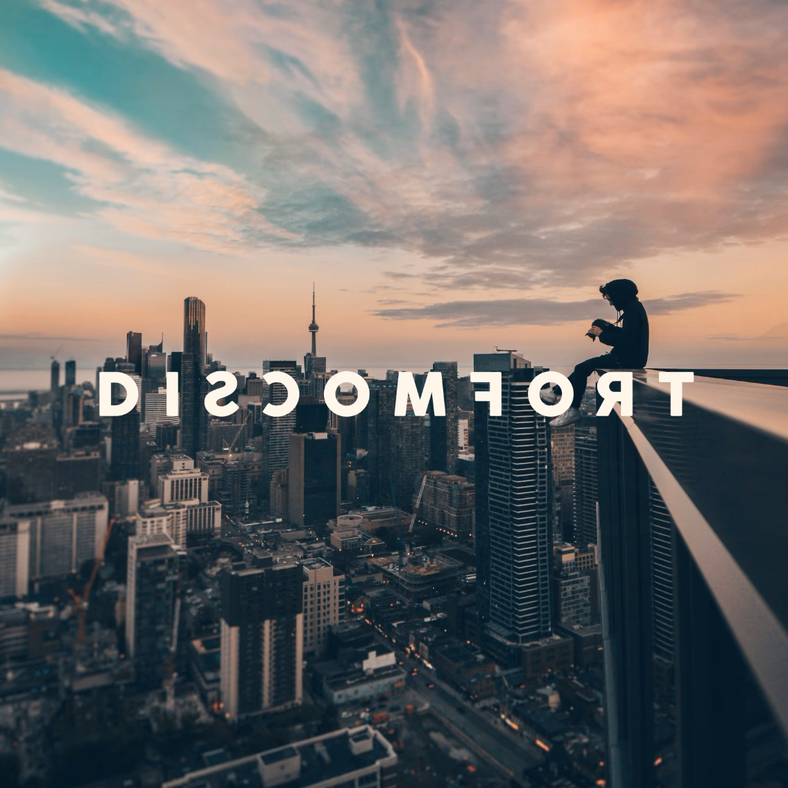 Seek Discomfort wordmark — mirror lettering detail.